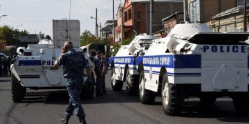 Policemen block a street after a group of armed men seized a police station along with an unknown number of hostages, according the country's security service, in Yerevan, Armenia, July 17, 2016. REUTERS/Melik Baghdasaryan/Photolure EDITORIAL USE ONLY. NO RESALES. NO ARCHIVE