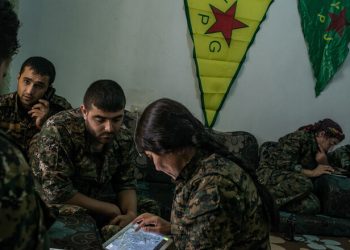 To follow a story on YPG fighters striking ISIS position by Rukmini Callimachi - Hasaka, Syria - July 31, 2015: YPG fighters check maps and location as they coordinate one air strike on ISIS position inside Hasaka, at a YPG headquarters on the outskirts of Hasaka. CREDIT: Photo by Mauricio Lima for The New York Times                              NYTCREDIT: Mauricio Lima for The New York Times