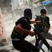 Free Syrian Army fighters exchange fire with regime forces in the Salah Al Din neighborhood of Aleppo, Aug. 22.