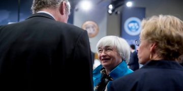 Janet Yellen, chair of the U.S. Federal Reserve, center, talks to Olivier Blanchard, chief economist of the International Monetary Fund (IMF), left, during the International Monetary Fund Committee (IMFC) governors plenary session at the International Monetary Committee (IMF) and World Bank Group Spring Meetings in Washington, D.C., U.S., on Saturday, April 18, 2015. IMF Managing Director Christine Lagarde warned this week that she wouldn't let Greece skip a debt payment to the lender, shutting down a potential avenue to buy the Greek government some financial leeway. Photographer: Andrew Harrer/Bloomberg via Getty Images