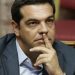 Greek Prime Minister Alexis Tsipras attends a parliamentary session in Athens, Friday, Aug. 14, 2015. Greek lawmakers are continuing a debate in parliament to approve a massive new bailout deal after repeated delays over procedure and dissent within the governing left-wing Syriza party caused the session to last through the night. (AP Photo/Yannis Liakos)