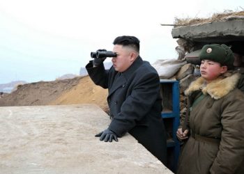 FILE - In this March 7, 2013 file photo released by the Korean Central News Agency (KCNA) and distributed by the Korea News Service, North Korean leader Kim Jong Un uses a pair of binoculars to look at the South's territory from an observation post at the military unit on Jangjae islet, located in the southernmost part of the southwestern sector of North Korea's border with South Korea. For the outside world, North Korea's message is largely doom and gloom: bombastic threats of nuclear war, amateur-looking videos showing U.S. cities in flames, digitally altered photos of military drills. But a domestic audience gets a parallel and decidedly softer dose of propaganda - and one with potentially higher stakes for the country's young leader. (AP Photo/KCNA via KNS, File)