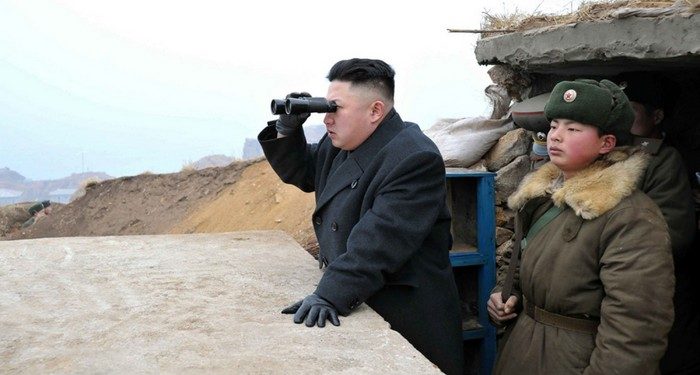 FILE - In this March 7, 2013 file photo released by the Korean Central News Agency (KCNA) and distributed by the Korea News Service, North Korean leader Kim Jong Un uses a pair of binoculars to look at the South's territory from an observation post at the military unit on Jangjae islet, located in the southernmost part of the southwestern sector of North Korea's border with South Korea. For the outside world, North Korea's message is largely doom and gloom: bombastic threats of nuclear war, amateur-looking videos showing U.S. cities in flames, digitally altered photos of military drills. But a domestic audience gets a parallel and decidedly softer dose of propaganda - and one with potentially higher stakes for the country's young leader. (AP Photo/KCNA via KNS, File)