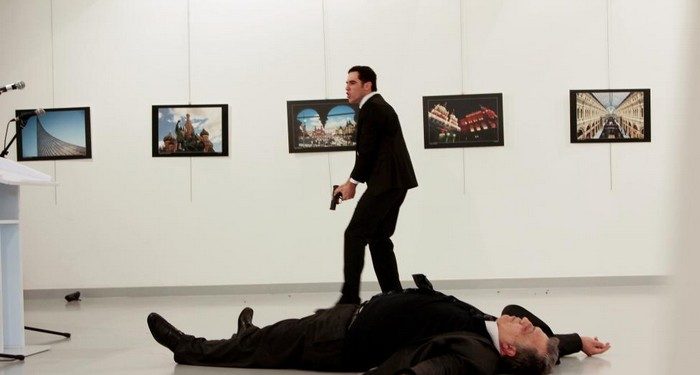 Russian Ambassador to Turkey Andrei Karlov lies on the ground after he was shot by unidentified man at an art gallery in Ankara, Turkey, December 19, 2016. Hasim Kilic/Hurriyet via REUTERS