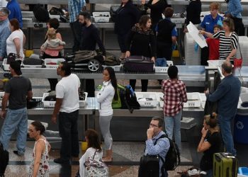 DENVER, CO - MAY 26: Travelers, at Denver International Airport, make there way through security lines as people start traveling for the long Memorial Day weekend, May 26, 2016. Officials at Denver International Airport are planing to see over million travelers during the Memorial Day weekend. Cutbacks in the Transportation Security Administration have caused thousands of travelers to miss their flights across the country. (Photo by RJ Sangosti/The Denver Post via Getty Images)