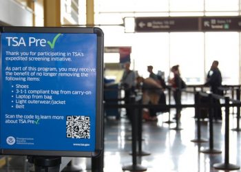 This undated image released by the Transportation Security Administration shows a sign promoting the TSA PreCheck program at at Reagan National Airport in Washington. The Transportation Security Administration's PreCheck program is open to some elite frequent fliers as well as travelers enrolled in one of the Customs & Border Protection's expedited entry programs: Global Entry, Nexus and Sentri. These travelers are considered less of a terrorist risk and therefore don't have to go through as stringent of a screening process.  (AP Photo/TSA)