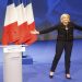 Far-right leader presidential candidate Marine Le Pen acknowledges applauses as she arrives as to a conference in Lyon, France, Sunday, Feb. 5, 2017. Marine Le Pen, the far-right presidential candidate, unveiled her platform Saturday at the start of a weekend conference, envisioning a thriving nation "made in France. (AP Photo/Michel Euler)
