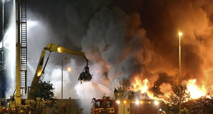 Firefighters work to extinguish flames after a massive blaze torched a recycling station in Malmo, Southern Sweden June 27, 2013. The fire broke out on Thursday evening around 7 pm local time in the area of Norra Hamnen. No casualties were reported. Picture taken June 27, 2013. REUTERS/Johan Nilsson/Scanpix Sweden (SWEDEN - Tags: DISASTER TPX IMAGES OF THE DAY) ATTENTION EDITORS - THIS IMAGE WAS PROVIDED BY A THIRD PARTY. FOR EDITORIAL USE ONLY. NOT FOR SALE FOR MARKETING OR ADVERTISING CAMPAIGNS. THIS PICTURE IS DISTRIBUTED EXACTLY AS RECEIVED BY REUTERS, AS A SERVICE TO CLIENTS.  NO COMMERCIAL SALES. SWEDEN OUT. NO COMMERCIAL OR EDITORIAL SALES IN SWEDEN - RTX114IN