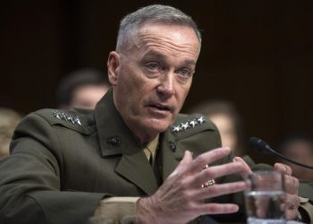 FILE - In this July 9, 2015, file photo, then-Marine Corps Commandant Gen. Joseph Dunford, Jr., testifies during his Senate Armed Services Committee confirmation hearing to become the Chairman of the Joint Chiefs of Staff, on Capitol Hill in Washington. The Marine Corps is expected to ask that women not be allowed to compete for several front-line combat jobs, inflaming tensions between Navy and Marine leaders, U.S. officials say. The tentative decision has ignited a debate over whether Navy Secretary Ray Mabus can veto any Marine Corps proposal to prohibit women from serving in certain infantry and reconnaissance positions. And it puts Dunford, the Marine Corps commandant who takes over soon as chairman of the Joint Chiefs of Staff, at odds with the other three military services, who are expected to open all of their combat jobs to women. (AP Photo/Cliff Owen, File)
