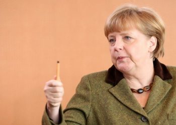 BERLIN, GERMANY - MARCH 13:  German Chancellor Angela Merkel arrives for the weekly German federal Cabinet meeting on March 13, 2013 in Berlin, Germany. High on the morning's agenda was discussion about the 2014 federal budget as well as options for helping women during pregnancy.  (Photo by Adam Berry/Getty Images)
