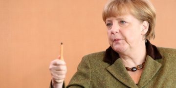 BERLIN, GERMANY - MARCH 13:  German Chancellor Angela Merkel arrives for the weekly German federal Cabinet meeting on March 13, 2013 in Berlin, Germany. High on the morning's agenda was discussion about the 2014 federal budget as well as options for helping women during pregnancy.  (Photo by Adam Berry/Getty Images)
