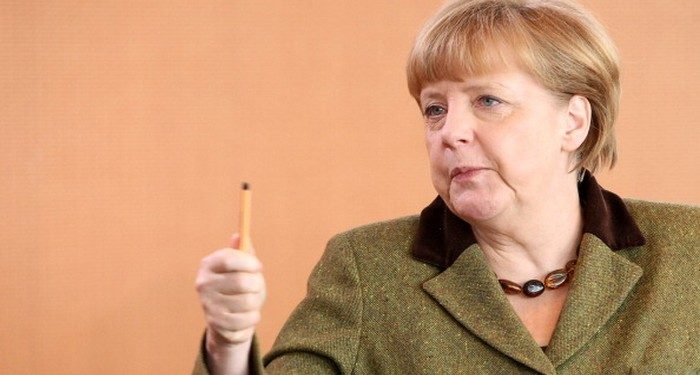 BERLIN, GERMANY - MARCH 13:  German Chancellor Angela Merkel arrives for the weekly German federal Cabinet meeting on March 13, 2013 in Berlin, Germany. High on the morning's agenda was discussion about the 2014 federal budget as well as options for helping women during pregnancy.  (Photo by Adam Berry/Getty Images)