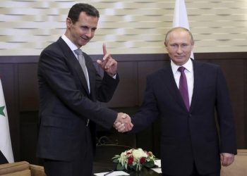 Russian President Vladimir Putin (R) meets with Syrian President Bashar al-Assad in the Black Sea resort of Sochi, Russia November 20, 2017. Sputnik/Mikhail Klimentyev/Kremlin via REUTERS
