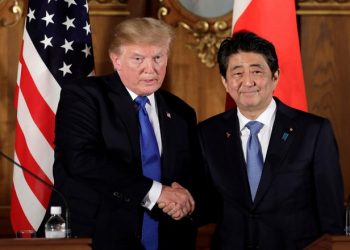 U.S. President Donald Trump, left, shakes hands with Shinzo Abe, Japan's prime minister, during a news conference at Akasaka Palace in Tokyo, Japan, November 6, 2017.   REUTERS/Kiyoshi Ota/Pool