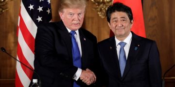 U.S. President Donald Trump, left, shakes hands with Shinzo Abe, Japan's prime minister, during a news conference at Akasaka Palace in Tokyo, Japan, November 6, 2017.   REUTERS/Kiyoshi Ota/Pool