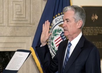 Jerome Powell takes the oath of office as Federal Reserve Board chairman at the Federal Reserve, Va., Monday, Feb. 5, 2018, in Washington. (AP Photo/Andrew Harnik)