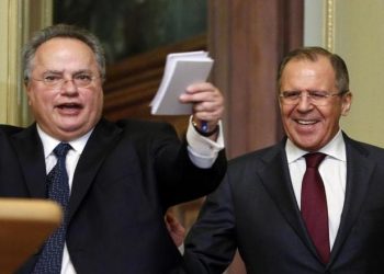 Russian Foreign Minister Sergei Lavrov (R) and his Greek counterpart Nikos Kotzias react during a news conference in Moscow, February 11, 2015. REUTERS/Maxim Zmeyev