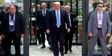 U.S. President Donald Trump is followed by National Security Advisor John Bolton (R) as he departs from the G7 summit in the Charlevoix city of La Malbaie, Quebec, Canada, June 9, 2018. REUTERS/Yves Herman
