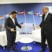 Turkey's President Recep Tayyip Erdogan, right, jokes with Greece's Prime Minister Alexis Tsipras, prior to their talks on the sidelines of a summit of heads of state and government at NATO headquarters in Brussels, Thursday, July 12, 2018.  NATO leaders gathered in Brussels for a two-day summit to discuss subjects including Russia, Iraq and their mission in Afghanistan. (Presidency Press Service via AP, Pool)