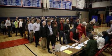 Voters line up to vote at a polling place in Doylestown, Pa., Tuesday, Nov. 6, 2018. (AP Photo/Matt Rourke)