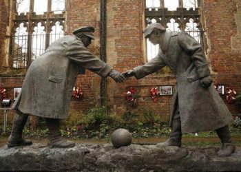 A resin sculpture, called "All Together Now", by artist Andrew Edwards, and depicting the Christmas Day football match between German and British soldiers fighting on the front line in World War One in 1914, is seen after being unveiled in the remains of St Luke's Church in Liverpool, northern England in this December 15, 2014 file photo. REUTERS/Phil Noble/Files