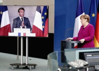 German Chancellor Angela Merkel listens during a joint press conference with French President Emmanuel Macron, who attends via video link, at the Chancellery in Berlin, Germany, on May 18, 2020 on the effects of the novel coronavirus COVID-19 pandemic. (Photo by Kay NIETFELD / POOL / AFP) (Photo by KAY NIETFELD/POOL/AFP via Getty Images)