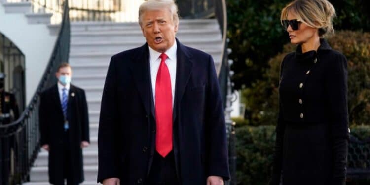 President Donald Trump and first lady Melania Trump stop to talk with the media as they walk to board Marine One on the South Lawn of the White House, Wednesday, Jan. 20, 2021, in Washington. Trump is en route to his Mar-a-Lago Florida Resort. (AP Photo/Alex Brandon)