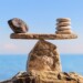 Symbol of scales is made of stones on the boulder