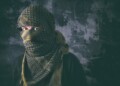 Masked criminal portrait with grungy background concept