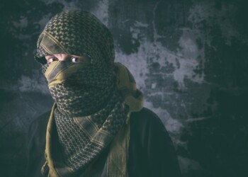 Masked criminal portrait with grungy background concept