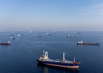 FILE PHOTO: Commercial vessels including vessels which are part of Black Sea grain deal wait to pass the Bosphorus strait off the shores of Yenikapi during a misty morning in Istanbul, Turkey, October 31, 2022. REUTERS/Umit Bektas/File Photo