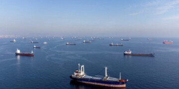 FILE PHOTO: Commercial vessels including vessels which are part of Black Sea grain deal wait to pass the Bosphorus strait off the shores of Yenikapi during a misty morning in Istanbul, Turkey, October 31, 2022. REUTERS/Umit Bektas/File Photo