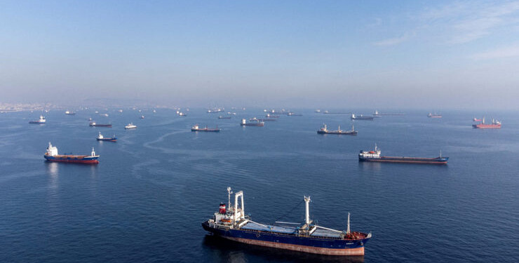 FILE PHOTO: Commercial vessels including vessels which are part of Black Sea grain deal wait to pass the Bosphorus strait off the shores of Yenikapi during a misty morning in Istanbul, Turkey, October 31, 2022. REUTERS/Umit Bektas/File Photo