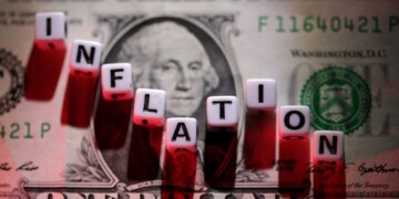 FILE PHOTO: Plastic letters arranged to read "Inflation" are placed on U.S. dollar banknote in this illustration taken, June 12, 2022. REUTERS/Dado Ruvic/Illustration