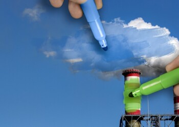 hands painting pollution blue and polluting chimneys green. Greenwashing malpractice concept