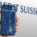 New York, US, March 2023: Hand holding a phone with the Credit Suisse logo on the cracked screen. In March 2023, Credit Suisse experienced a sharp drop in its stock price. Illustrative editorial