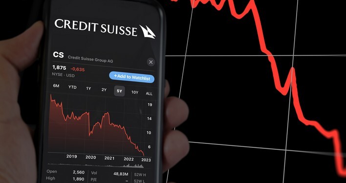 New York, US, March 2023: hand holding a phone with the performance of Credit Suisse on stock market. In March 2023, Credit Suisse experienced a sharp drop in its stock price. Illustrative editorial