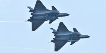 FILE PHOTO: Chengdu J-20 stealth fighter jets of Chinese People's Liberation Army (PLA) Air Force perform with open weapon bays during the China International Aviation and Aerospace Exhibition, or Zhuhai Airshow, in Zhuhai, Guangdong province, China November 11, 2018. REUTERS/Stringer