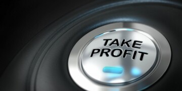 take profit button over black background with blur effect, market investment, conceptual image