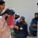 People mourn for their relative, who was killed in a bomb explosion, at a hospital, in Quetta, Pakistan, Friday, Sept. 29, 2023. A powerful bomb exploded at a rally celebrating the birthday of Islam's Prophet Muhammad in southwest Pakistan on Friday, killing multiple people and wounding dozens of others, police and a government official said. (AP Photo/Arshad Butt)