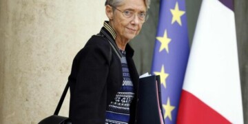(FILES) French Prime Minister Elisabeth Borne leaves at the end of the weekly cabinet meeting at the Elysee palace in Paris, on October 5, 2022. French Prime Minister Elisabeth Borne has tendered her resignation from the government, French President Emmanuel Macron has accepted it, announced the presidency on January 8, 2024. (Photo by Ludovic MARIN / AFP)