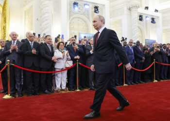 In this pool photograph distributed by Russian state agency Sputnik, Russian president-elect Vladimir Putin walks prior to his inauguration ceremony at the Kremlin in Moscow on May 7, 2024. (Photo by Artem Geodakyan / POOL / AFP)