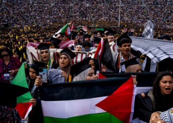 ANN ARBOR, MICHIGAN - MAY 4: Students demonstate during a Pro-Palestinian protest during the University of Michigan's spring commencement ceremony on May 4, 2024 at Michigan Stadium in Ann Arbor, Michigan. A group of students called for the University of Michigan to divest from companies with ties to Israel during the spring commencement ceremony.   Nic Antaya/Getty Images/AFP (Photo by Nic Antaya / GETTY IMAGES NORTH AMERICA / Getty Images via AFP)