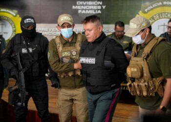 Bolivian police hold the detained Juan Jose Zuniga, former general commander of the Army, in La Paz, Bolivia, Wednesday, June 26, 2024. An apparent failed coup attempt erupted Wednesday in the country, and Zuniga appeared to be leading the rebellion. (AP Photo/Juan Karita)