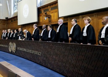 (From R) South African Judge Dire Tladi, US Judge Sarah Cleveland, Brazilian Judge Leonardo Nemer Caldeira Brant, German Judge Georg Nolte, Idian Judge Dalveer Bhandari, Somali Judge Abdulqawi Yusuf, Slovak Judge Peter Tomka, Lebanese Judge and President of the International Court of Justice (ICJ) Nawaf Salam, Ugandan Judge and 
Vice-President of the International Court of Justice Julia Sebutinde, French Judge Ronny Abraham, Chinese Judge Xue Hanqin, Japanese Judge Yuji Iwasawa, Australian Judge Hilary Charlesworth, Mexican Judge Juan Manuel Gomez Robledo, Romanian Judge Bogdan Lucian Aurescu rise before delivering a non-binding ruling on the legal consequences of the Israeli occupation of the West Bank and East Jerusalem at the International Court of Justice (ICJ) in The Hague on July 19, 2024. - The UN's top court handed down its view, on July 19, 2024, declaring "illegal" Israel's occupation of Palestinian territories since 1967, amid growing international pressure over the war in Gaza. (Photo by Nick Gammon / AFP)