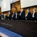 (From R) South African Judge Dire Tladi, US Judge Sarah Cleveland, Brazilian Judge Leonardo Nemer Caldeira Brant, German Judge Georg Nolte, Idian Judge Dalveer Bhandari, Somali Judge Abdulqawi Yusuf, Slovak Judge Peter Tomka, Lebanese Judge and President of the International Court of Justice (ICJ) Nawaf Salam, Ugandan Judge and 
Vice-President of the International Court of Justice Julia Sebutinde, French Judge Ronny Abraham, Chinese Judge Xue Hanqin, Japanese Judge Yuji Iwasawa, Australian Judge Hilary Charlesworth, Mexican Judge Juan Manuel Gomez Robledo, Romanian Judge Bogdan Lucian Aurescu rise before delivering a non-binding ruling on the legal consequences of the Israeli occupation of the West Bank and East Jerusalem at the International Court of Justice (ICJ) in The Hague on July 19, 2024. - The UN's top court handed down its view, on July 19, 2024, declaring "illegal" Israel's occupation of Palestinian territories since 1967, amid growing international pressure over the war in Gaza. (Photo by Nick Gammon / AFP)