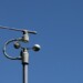 Weather station instruments against blue sky background
