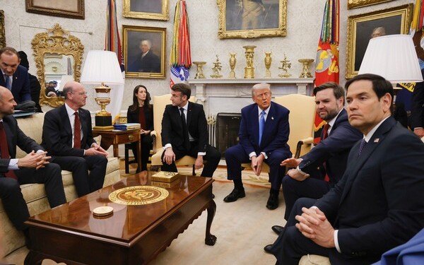 France's President Emmanuel Macron, from center to right, President Donald Trump, Vice President JD Vance and Secretary of State Marco Rubio attend a meeting in the Oval Office of the White House in Washington, Monday, Feb. 24, 2025. (Ludovic Marin/Pool via AP)
