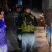 An Indian army officer stands guard as tourists look on at a temporary checkpoint near Pahalgam in south Kashmir after assailants indiscriminately opened fire on tourists visiting Pahalgam, Indian controlled Kashmir, Tuesday, April 22, 2025. (AP Photo/Dar Yasin)