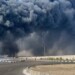 In this photo provided by Iranian Students' News Agency, ISNA, a black smoke rises in the sky after a massive explosion rocked a port near the southern port city of Bandar Abbas, Iran, Saturday, April 26, 2025. (Razieh Pudat/ISNA via AP)